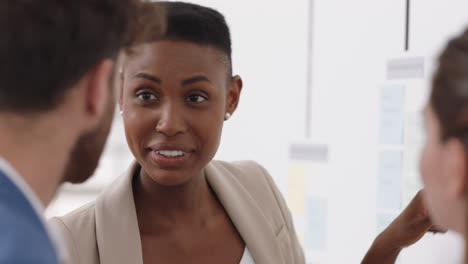 african-american-business-woman-using-sticky-notes-brainstorming-problem-solving-with-diverse-colleagues-sharing-creative-ideas-for-solution-in-office-meeting