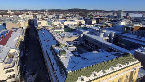 aerial shot of jyväskylä, finland with frozen lake in background