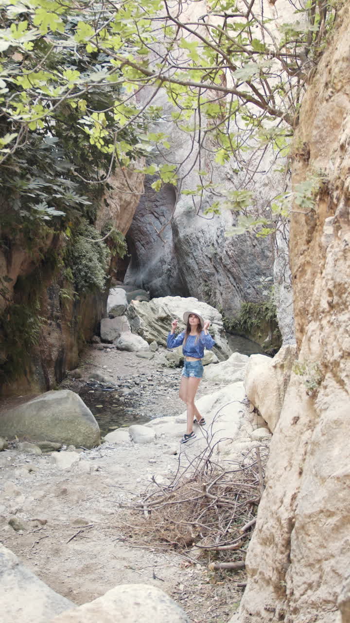 Woman hiking in canyon