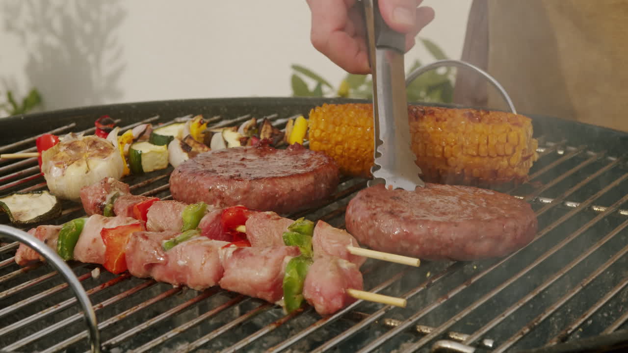 Grilling burgers, sausages, and vegetables