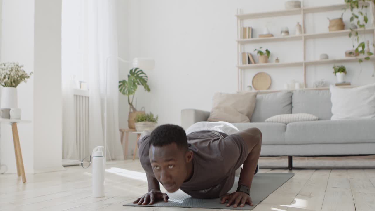 Man doing push-ups at home