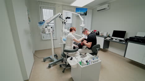 dentists and patient in clinic. medical treatment at dentist office