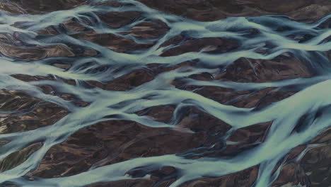 braided streams of glacial river in kálfafell, iceland - aerial drone shot