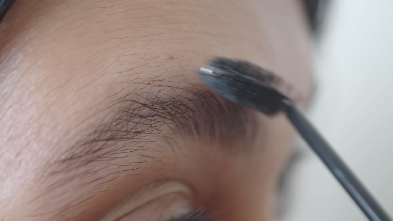 Applying eyebrow makeup