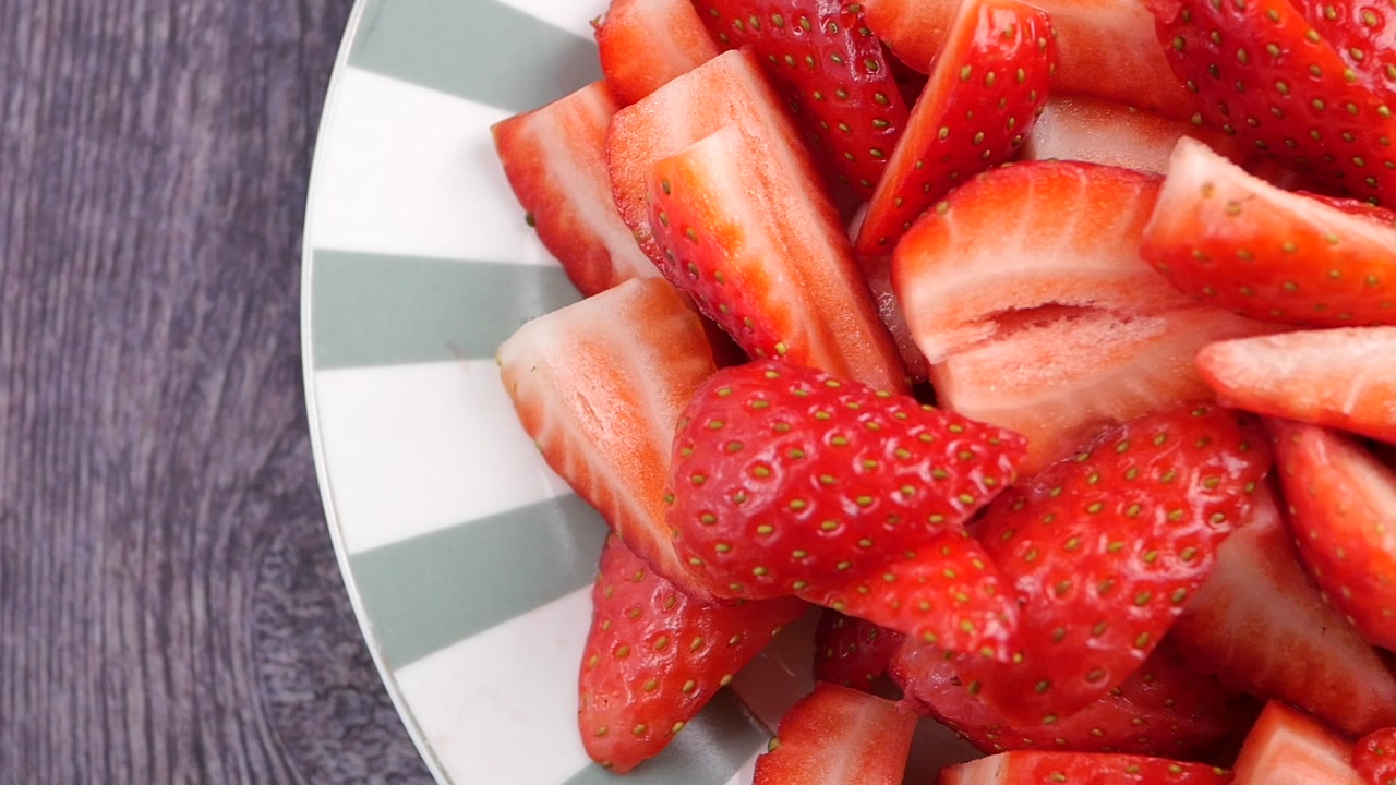 Close-up of Fresh Sliced Strawberries in a Bowl
