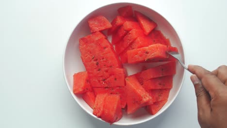 sliced watermelon in a white bowl