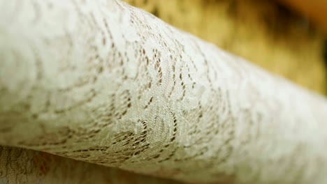 macro shot of a lace, fabric used to make elegant wedding dresses for the wedding day.