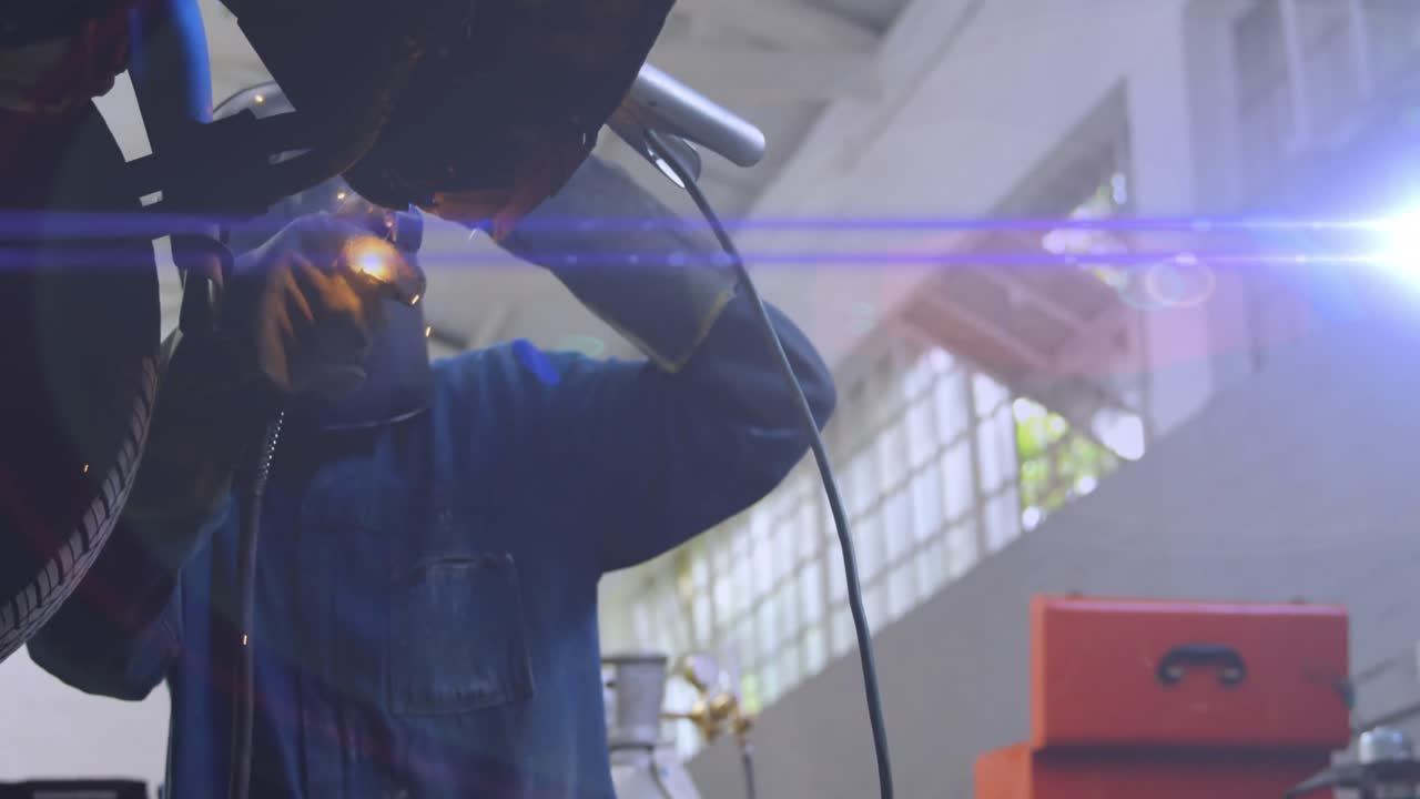 Animation of purple light trail pattern moving over welder