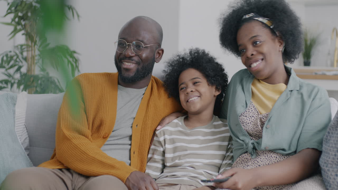 Happy Family Watching TV