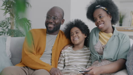 happy family watching tv