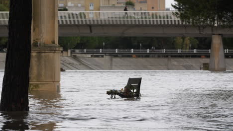 public bench in a flooded river le lez montpellier antigone france heavy rain