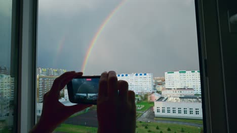 rainbow viewed through a window
