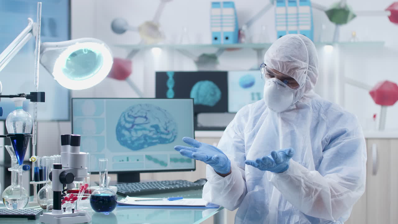 Scientist in Protective Suit in Laboratory