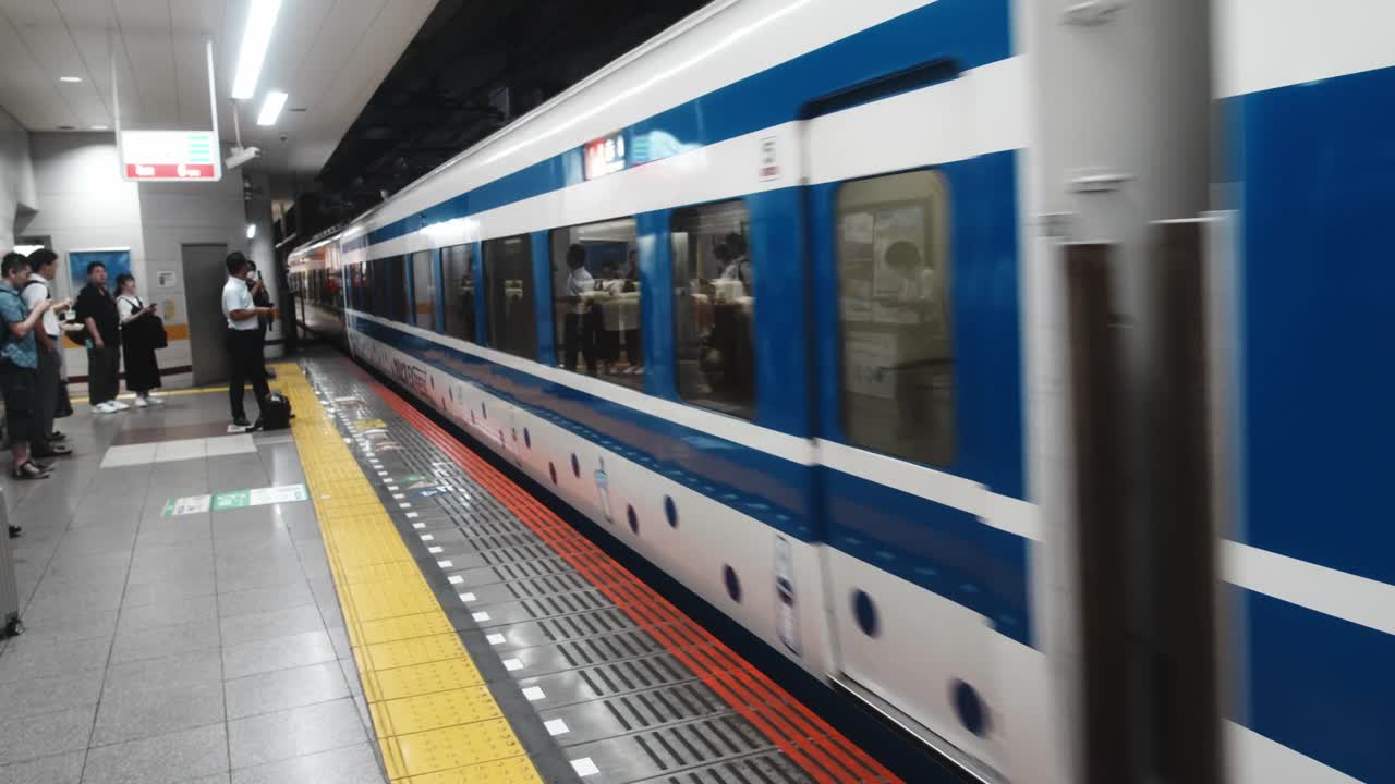 4k cinematic footage of a train entering Tokyo station