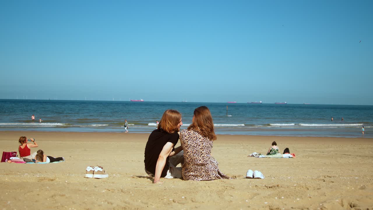 Couple Relaxing on a Sunny Beach