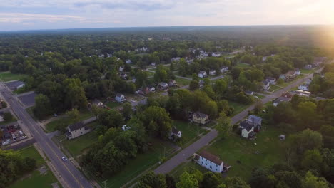 forward and panning down drone shot of houses on a late summer day in youngstown ohio