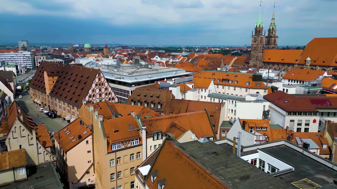4K Aerial Drone Video of Copper-clad Cupolas, Church Spiers, and Tiled Roof of St. Lawrence Church in Downtown Nurnberg, Germany