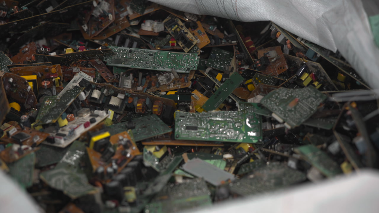 Closeup Reclaimed Circuit Boards Pile Dense Assortment Of PCBs Showing Traces, Solder Joints, Yellow . Media