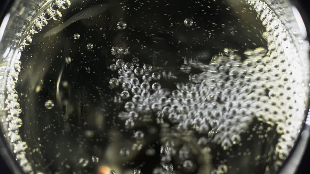 Pouring a refreshing foamfilled beverage into a tall glass for enjoying with friends