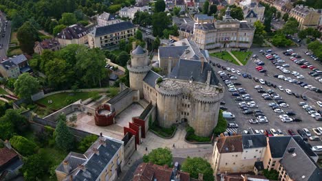 sideways aerial movement around the castle of the dukes of alencon, alencon, orne, france