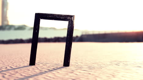 empty wooden picture frame on the beach sand