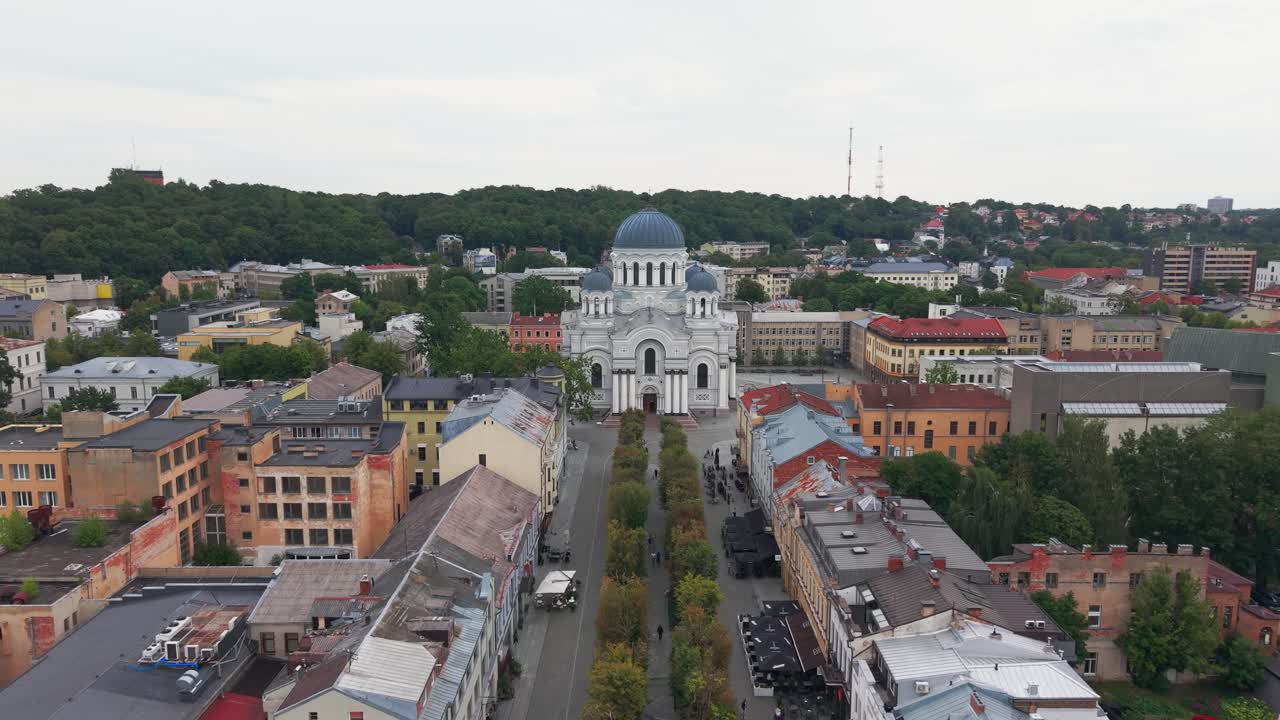 Experience a breathtaking aerial view of the Church of St. Michael the Archangel in Kaunas. Marvel at the architectural beauty set against the city's diverse skyline with no people visible