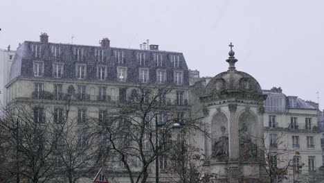 snow falling in paris at place saint-sulpice