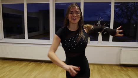 professional and passionate female dancer dances on the dance floor slow motion