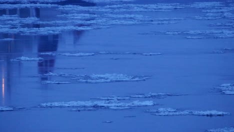 A-big-boat-passes-on-a-cold-and-dark-river