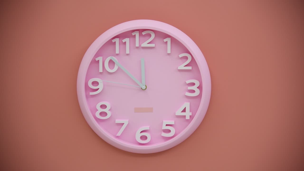 Orologio rosa su parete rosa