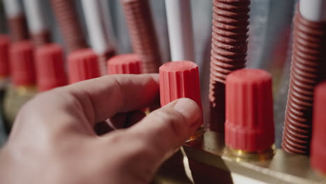 person adjusts the heating system. regulates the supply of hot water to radiators and underfloor heating