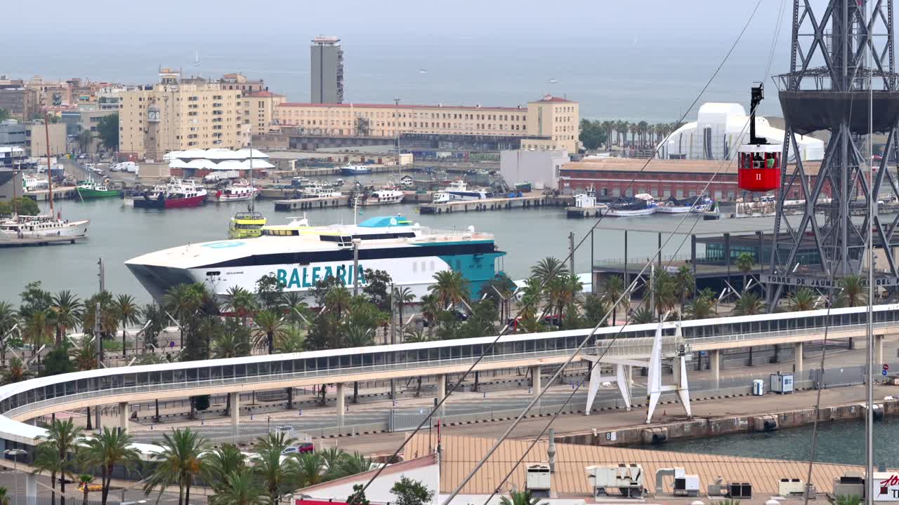 Barcelona, Spain - June 25, 2021: Aerial drone view of boats docked in the Port Vell