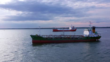 oil ship tanker and lpg ship navigating on the ocean near port of balikpapan, indonesia