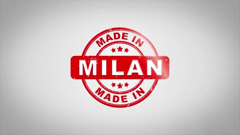 made in milan signed stamping text wooden stamp animation. red ink on clean white paper surface background with green matte background included.