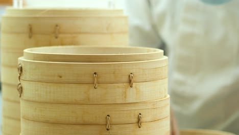 close-up of bamboo steamers used for dim sum preparation