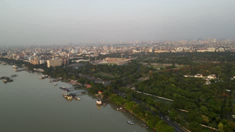 aerial drone shot of eden gardens stadium in kolkata, surrounded by the city’s bustling streets.