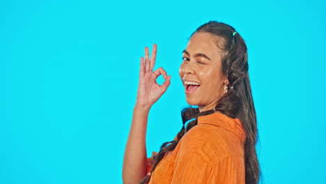 smile, wink and okay hand gesture