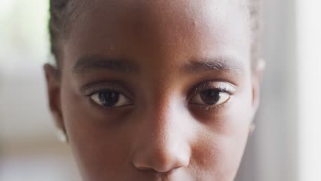 video close up portrait of opening eyes of african american girl