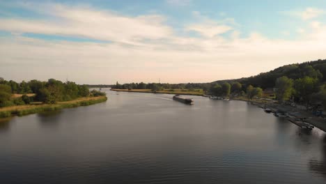 oder river with traveling bulk carrier ship in poland, central europe