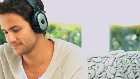 handsome man listening to music
