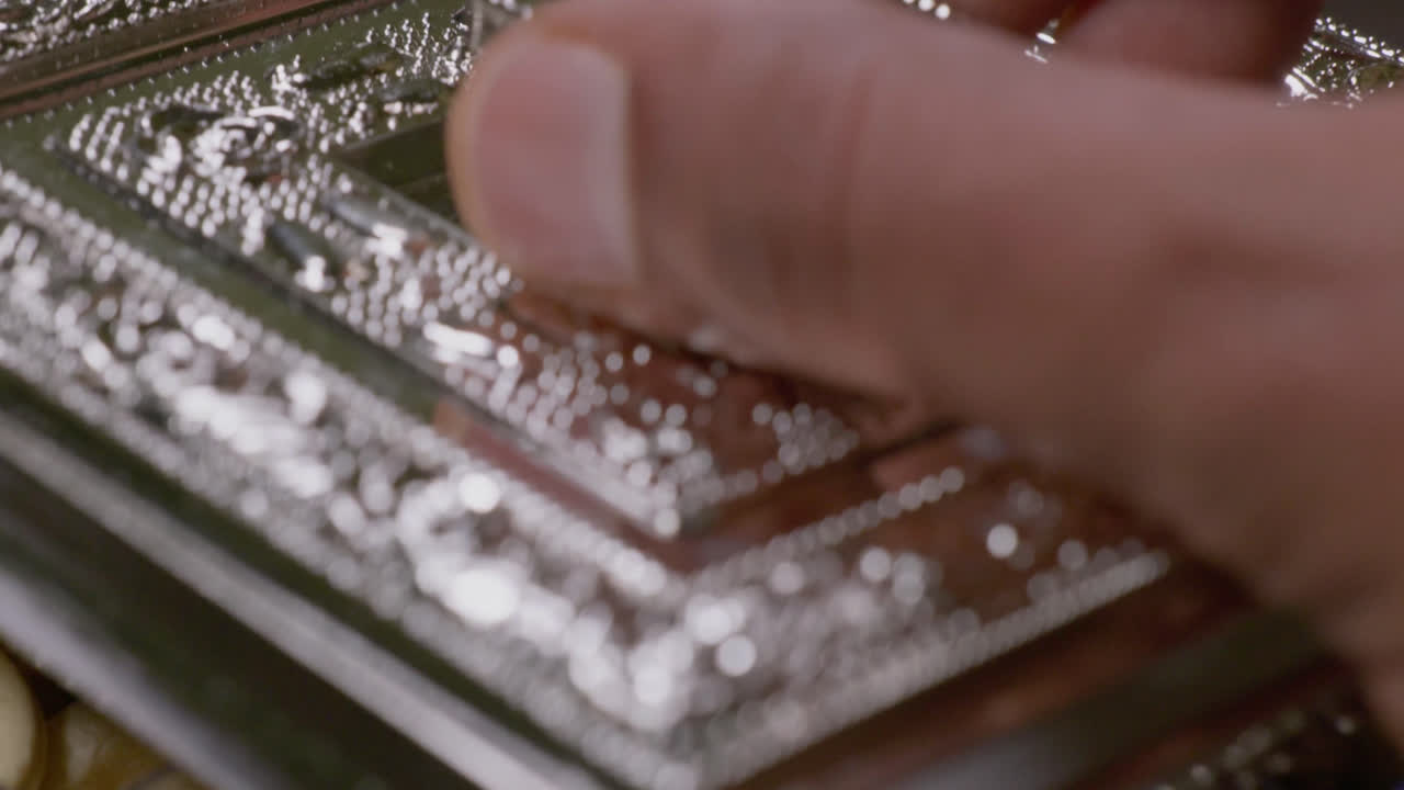 brown hand opening fancy silver box with cashew nuts inside, close up, slo w motion stable shot, 4k
