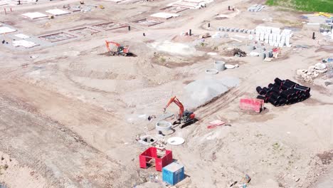 UK-town-housing-development-working-foundation-construction-site-aerial-view-from-above