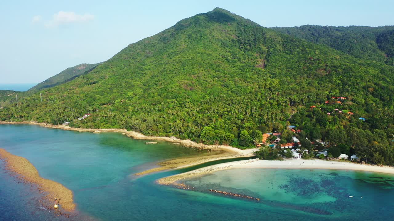 Beautiful natural palm forest on the sandy coast of Thailand island. emerald sea and small channel