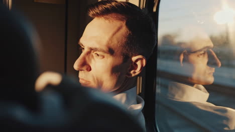man in a train window