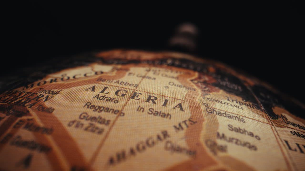 Close-up of Algeria on a vintage world globe