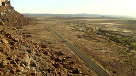 drone following rv driving through utah desert on american road trip, near canyonlands national park