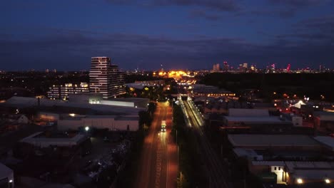 wide angle aerial panorama of east london skyline at night, england