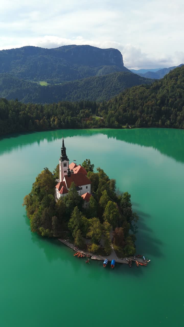 Vertical aerial view of Bled island and Church of the Assumption of St. Mary