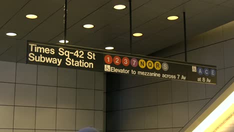 close up of the times sqaure subway station sign