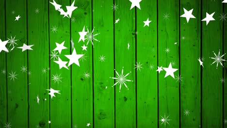 animación de estrellas de navidad cayendo sobre un fondo de madera verde